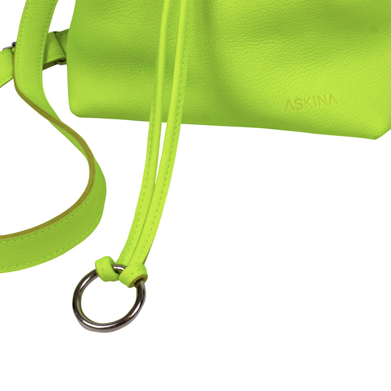 Leather bucket bag in yellow neon on a white background